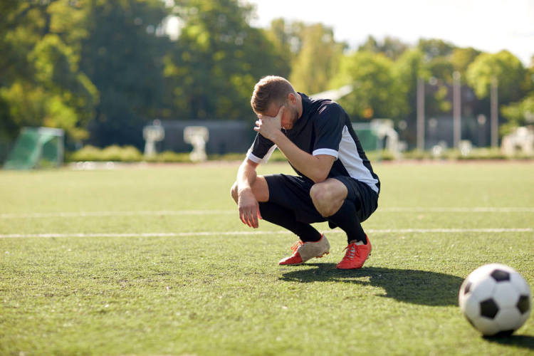 Defeated football player