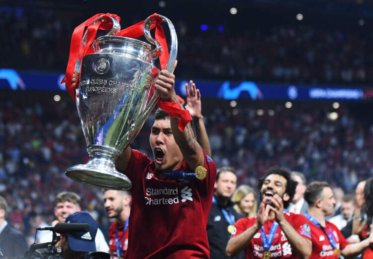 Roberto Firmino of Liverpool lifting the Champions League 18/19 trophy