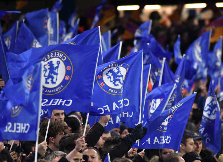 Chelsea FC fans with Chelsea flags.