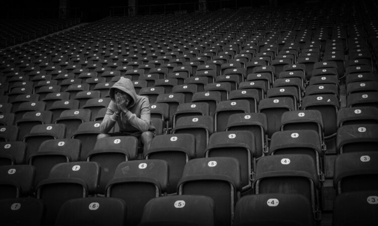 Sad fan in football stadium