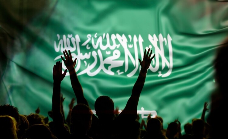 Football supporters and Saudi Arabia flag