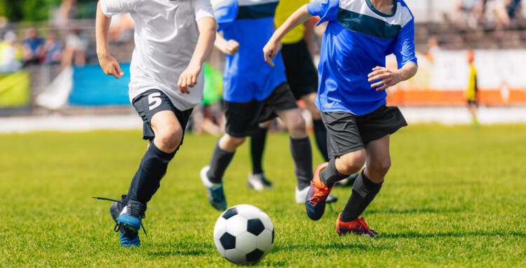 Young kids playing football