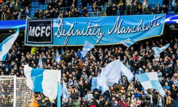 Manchester City fans during a Champions League match.