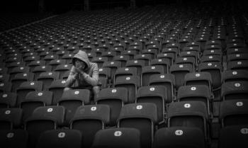 Sad fan in football stadium