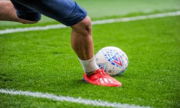 Football player kicking ball, English Championship