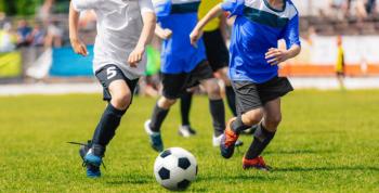 Young kids playing football